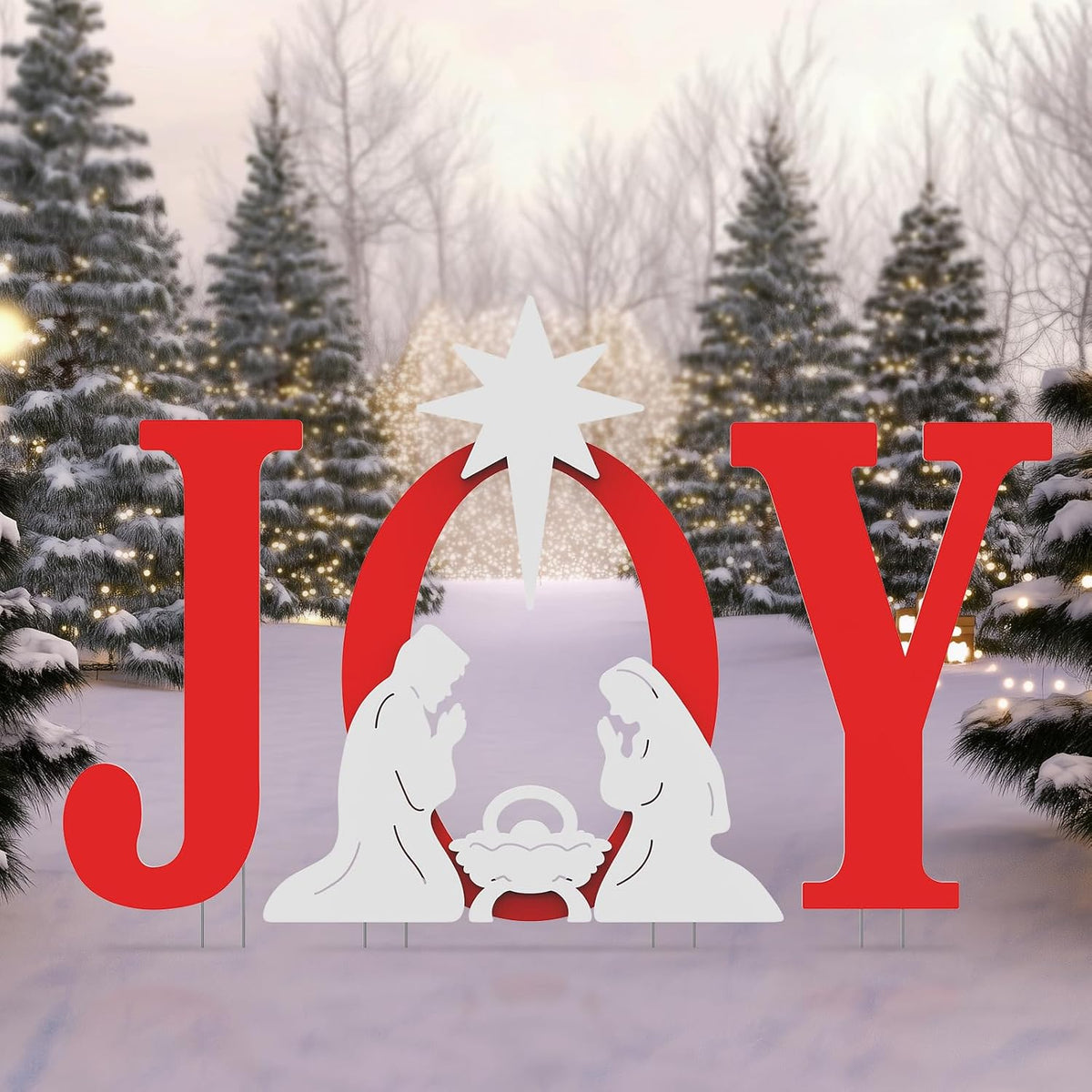 Red JOY yard letters with a white nativity silhouette and star in the O in a snowy yard