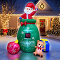 Green Santa gift sack inflatable with a Days Until Christmas countdown, an ornament and a teddy bear