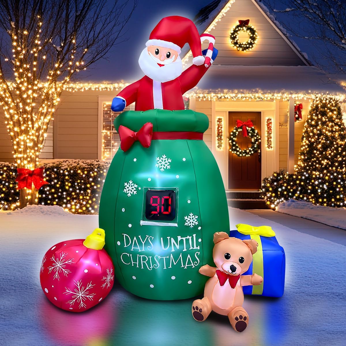 Green Santa gift sack inflatable with a Days Until Christmas countdown, an ornament and a teddy bear