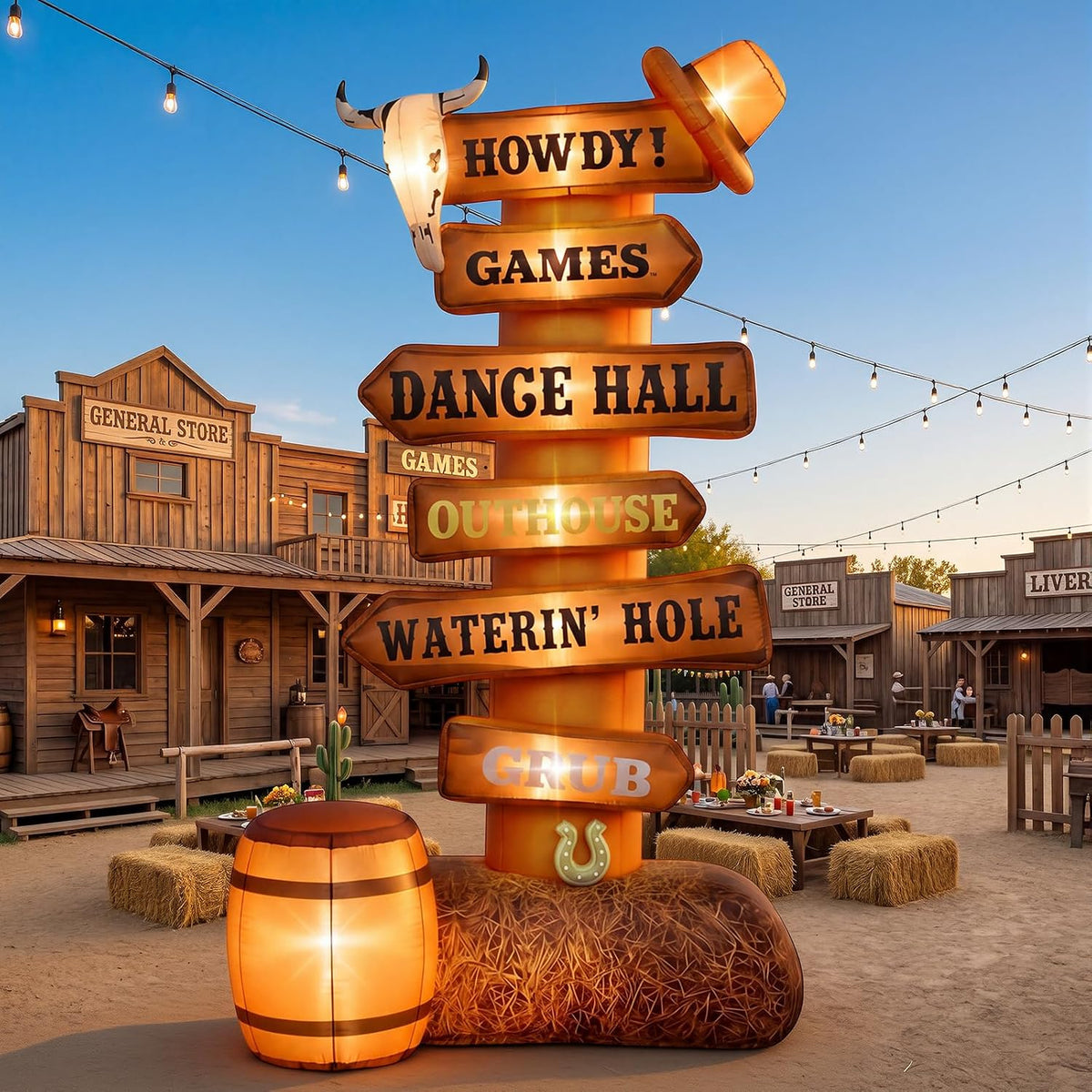 Wooden-look western signpost inflatable with Howdy and Dance Hall arrows at a western town party