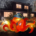 Orange octopus inflatable in a pirate hat and eye patch holding a cutlass at night