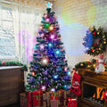Fiber optic Christmas tree glowing in multiple colors in a living room with gifts underneath